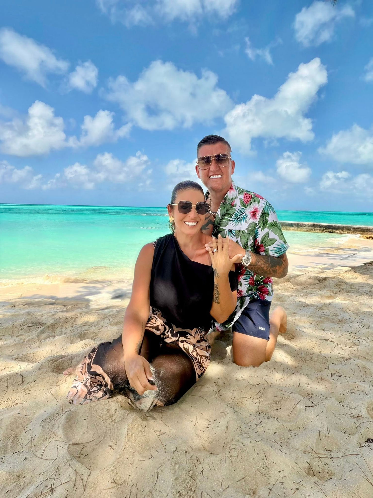 Katie and Matt on the beach where Matt proposed